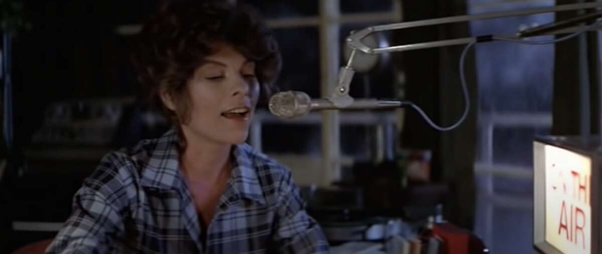 Stevie Wayne (Adrienne Barbeau) speaks during her radio show inside the lighthouse.