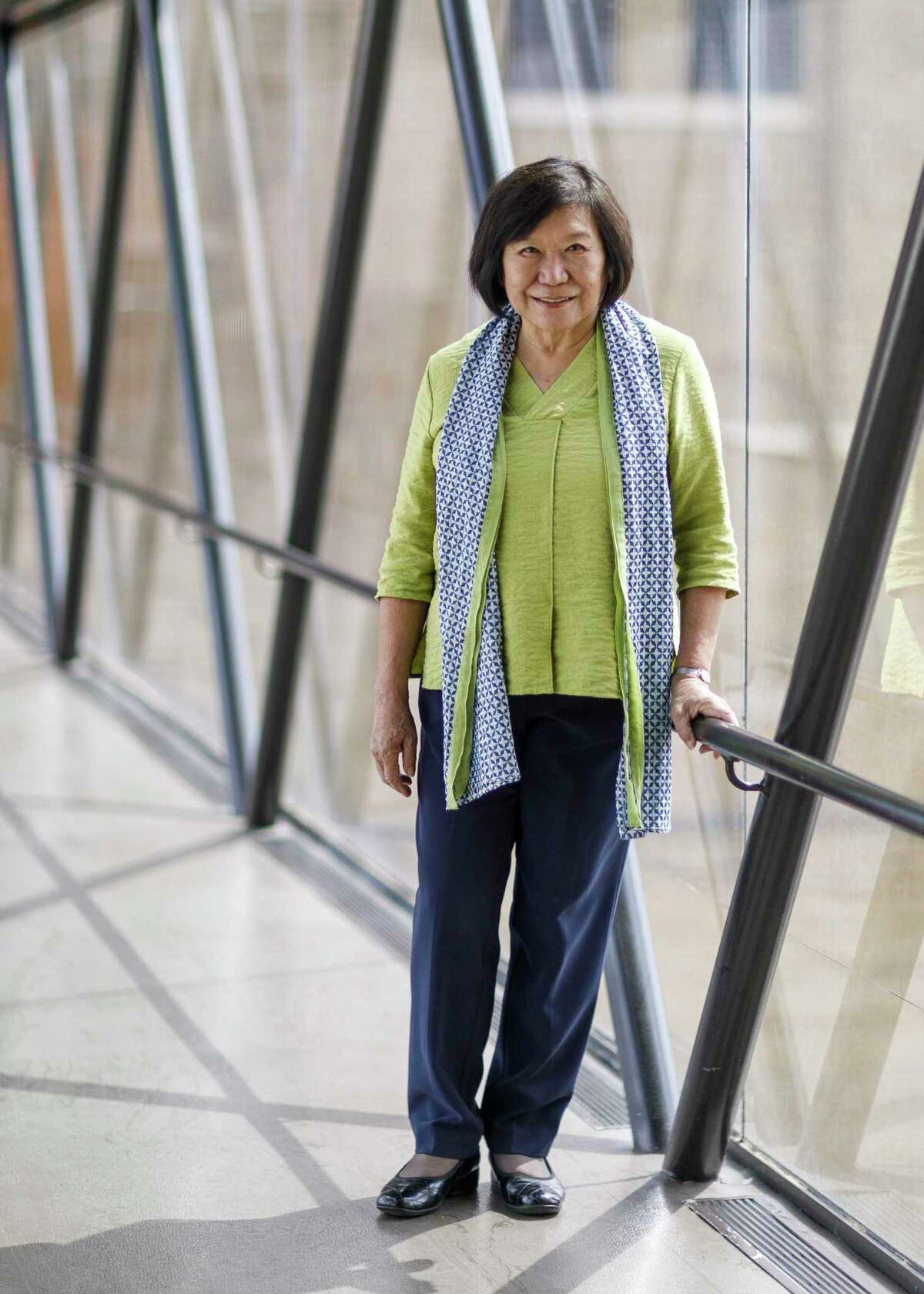 Co-Interim Director Dr. Emily Sano stands in the glass sky bridge that connects parts of San Antonio Museum of Art in San Antonio, Texas, Friday, Oct. 1, 2021. She joined the SAMA staff in January 2016 as the Coates-Cowden-Brown Senior Advisor for Asian Art.