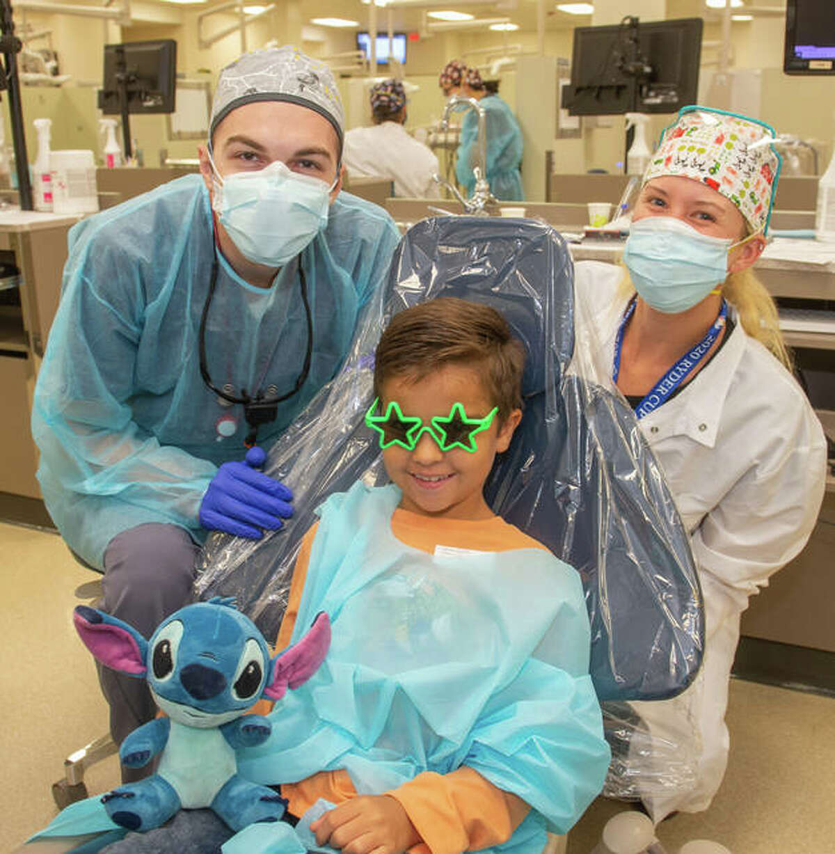 A child receives dental care during the SIU SDM’s Give Kids a Smile Day event on Oct. 11. A record number of 126 children received treatments valued at more than $61,000 on Monday.