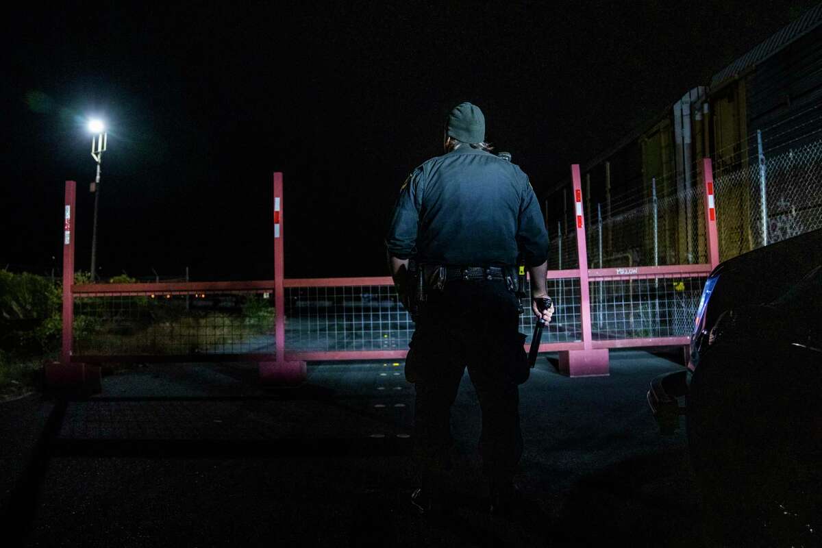 Richmond police Officer Ben Therriault of the Richmond Police Department checks out a new barrier placed at an industrial park frequented by sideshow participants.