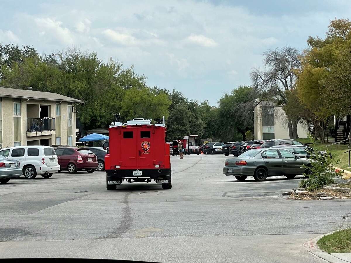 San Antonio police and firefighters respond to the scene where a man fired several shots Wednesday afternoon at the Seven Oaks apartments, 5903 Danny Kaye Drive.