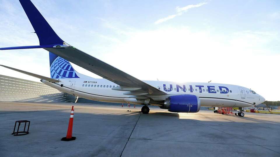 A United Airlines 737 8-Max plane waits outside the airline's hanger before a test flight with 100 percent sustainable aviation fuel takes off from IAH in Houston on Wednesday, Oct. 13, 2021. The airline is hoping to have its whole fleet be sustainable in 2050.