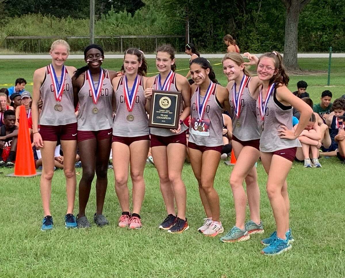 The Cinco Ranch girls cross country team of Alison Mueller, Anika Mueller, Helen Ullrich, Natalia Corser, Jennifer Edozie, Logan Mclean and Lindsay Krippner won the District 19-6A championship Oct. 12 at Paul D. Rushing Park.
