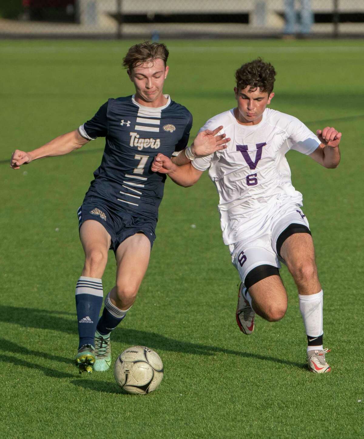 Cohoes' Zack Halloran, left, battles for the ball with Voorheesville's Sean Bruno during the Colonial Council tournament boys' soccer game on Wednesday, Oct, 13, 2021 in Troy, N.Y.