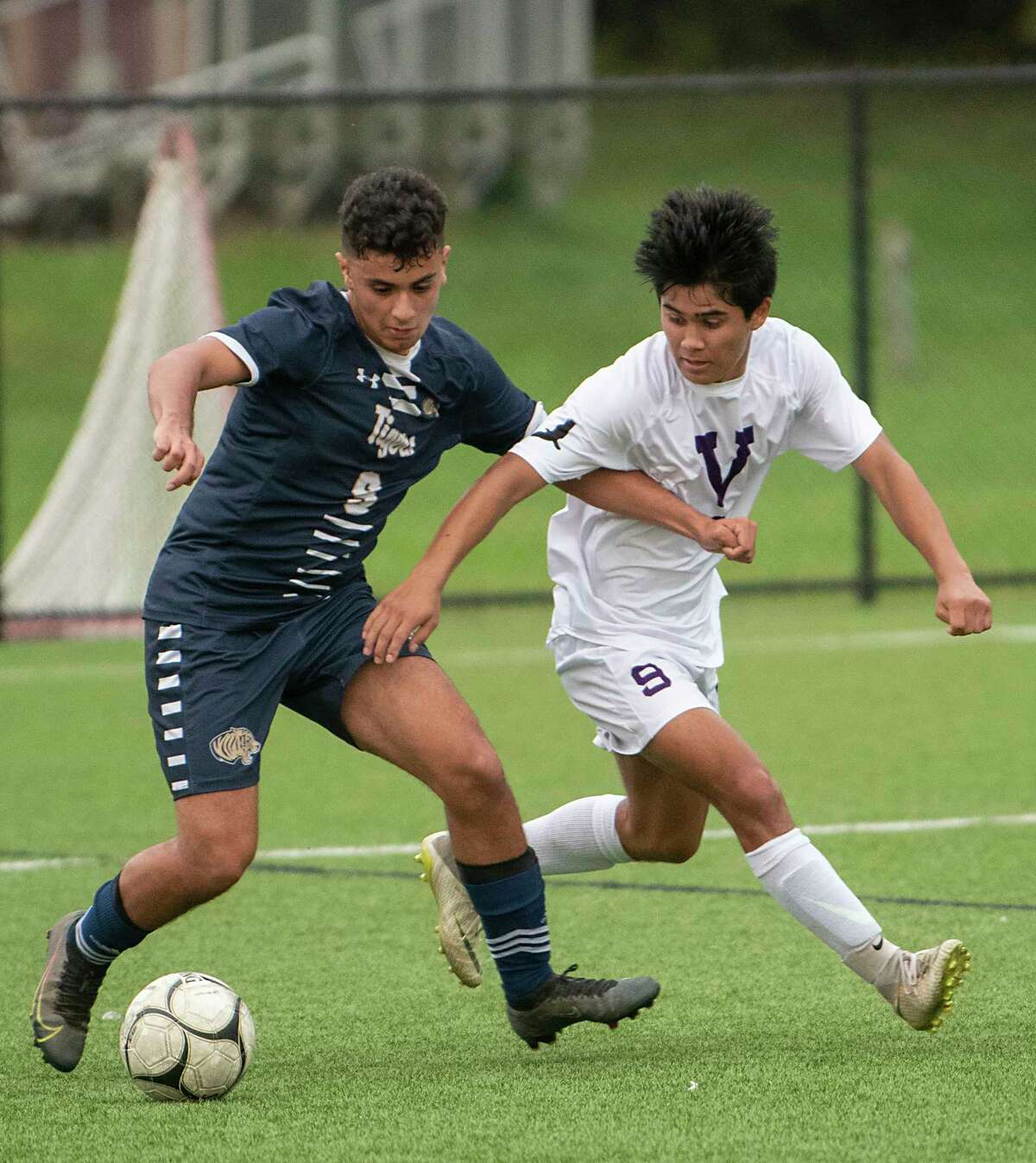 Cohoes' Johnny Martinez-Peraza, left, battles for the ball with Voorheesville's Dylan Enslinn during the Colonial Council tournament boys' soccer game on Wednesday, Oct, 13, 2021 in Troy, N.Y.