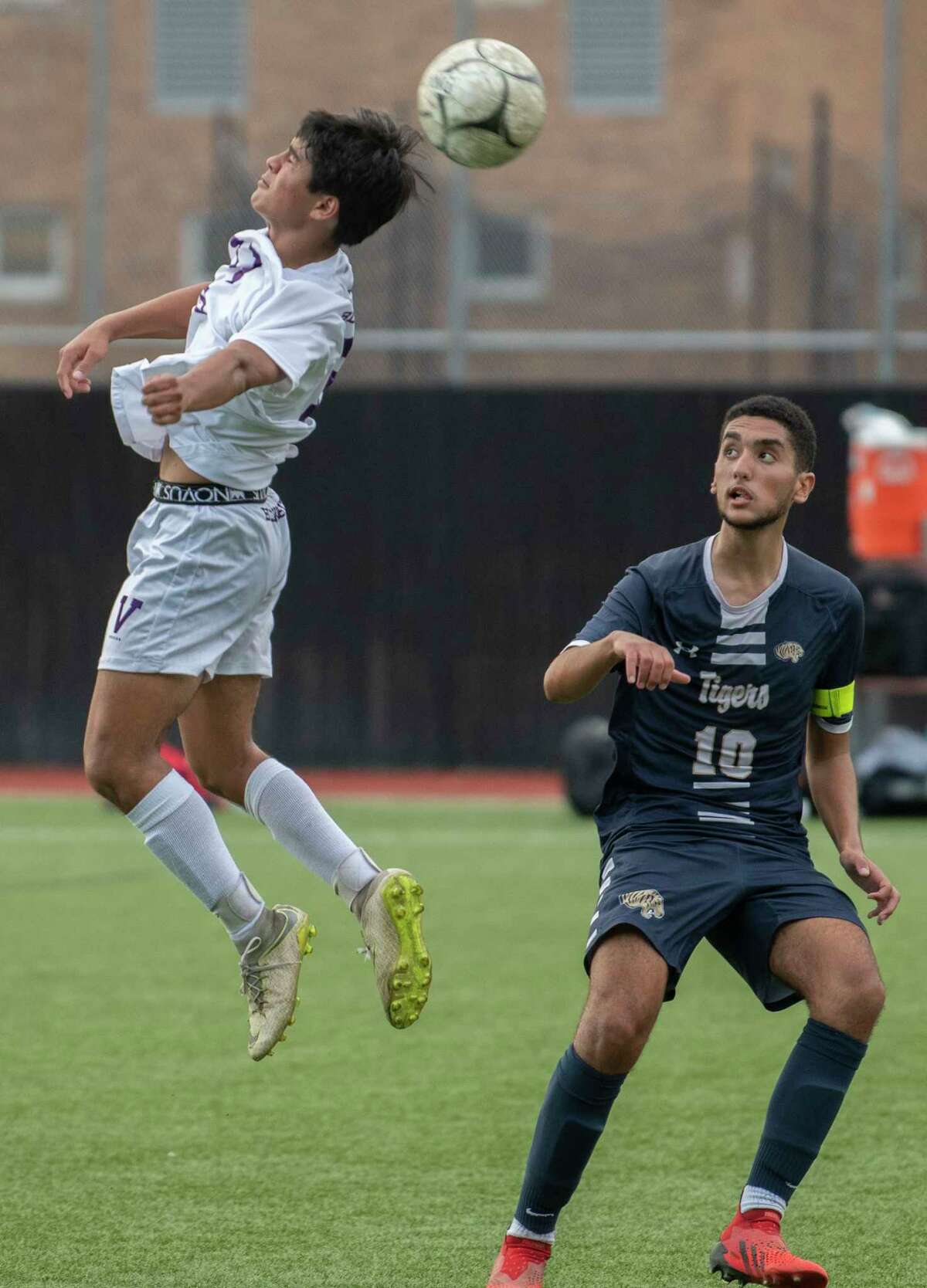 Voorheesville's Dylan Enslinn, left, heads the ball past Cohoes' Jad Essoulaimani during the Colonial Council tournament boys' soccer game on Wednesday, Oct, 13, 2021 in Troy, N.Y.