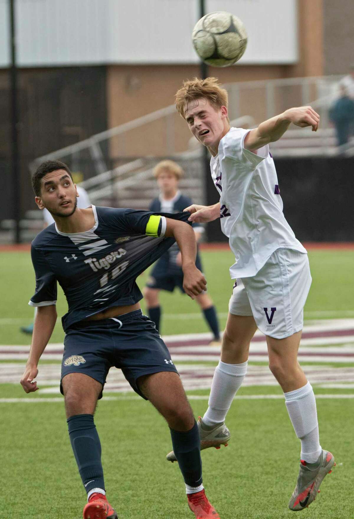 Cohoes' Jad Essoulaimani, left, battles for the ball with Voorheesville's Daniel Wittman during the Colonial Council tournament boys' soccer game on Wednesday, Oct, 13, 2021 in Troy, N.Y.