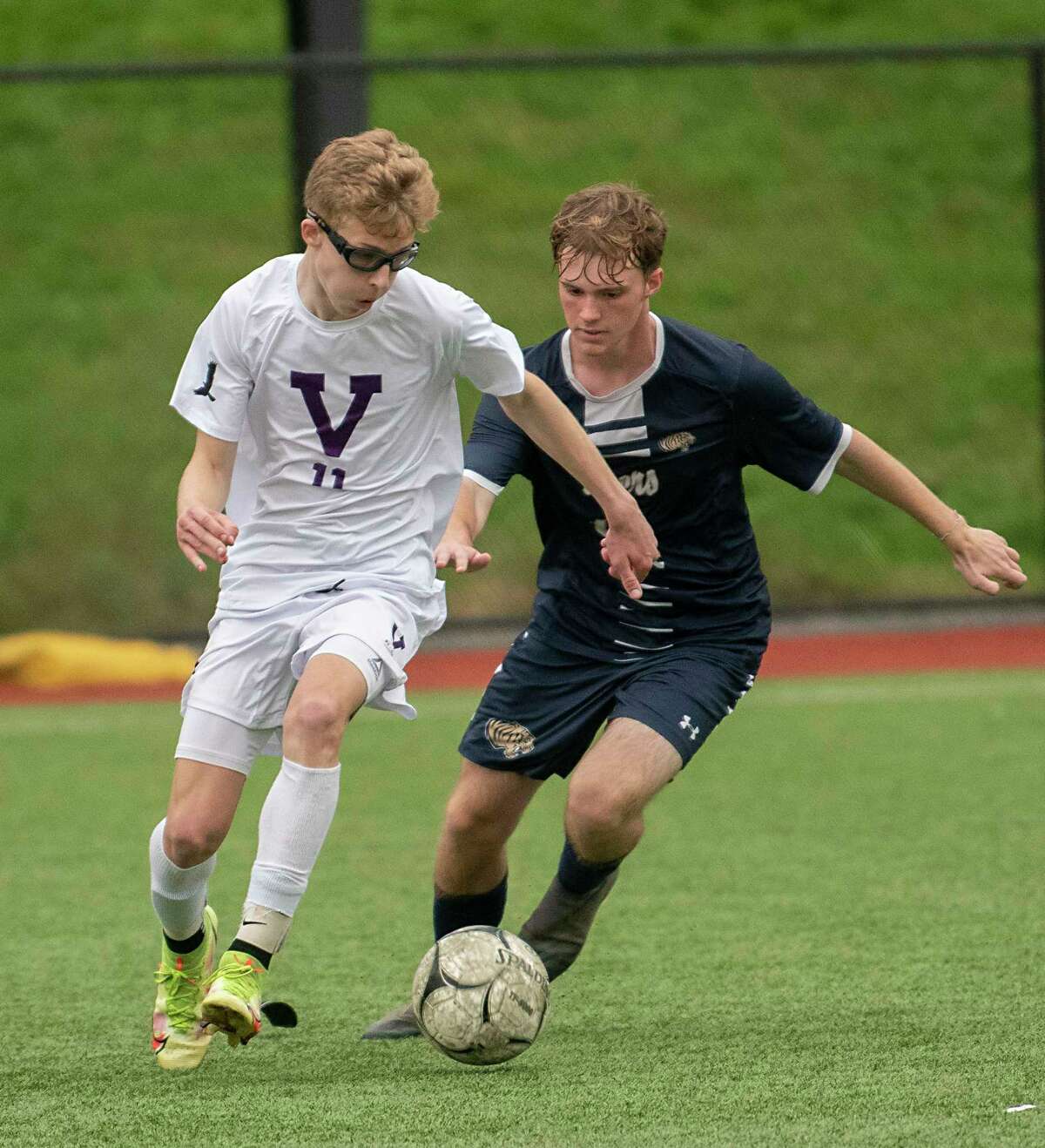Voorheesville's Aidan Lawson, left, battles for the ball with Cohoes' Ryan Primeau during the Colonial Council tournament boys' soccer game on Wednesday, Oct, 13, 2021 in Troy, N.Y.