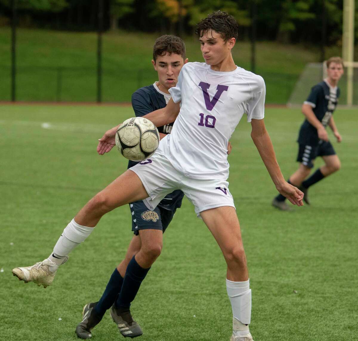 Cohoes' Kyle Smith, left, defends Voorheesville's Ryan McMillen during the Colonial Council tournament boys' soccer game on Wednesday, Oct, 13, 2021 in Troy, N.Y.