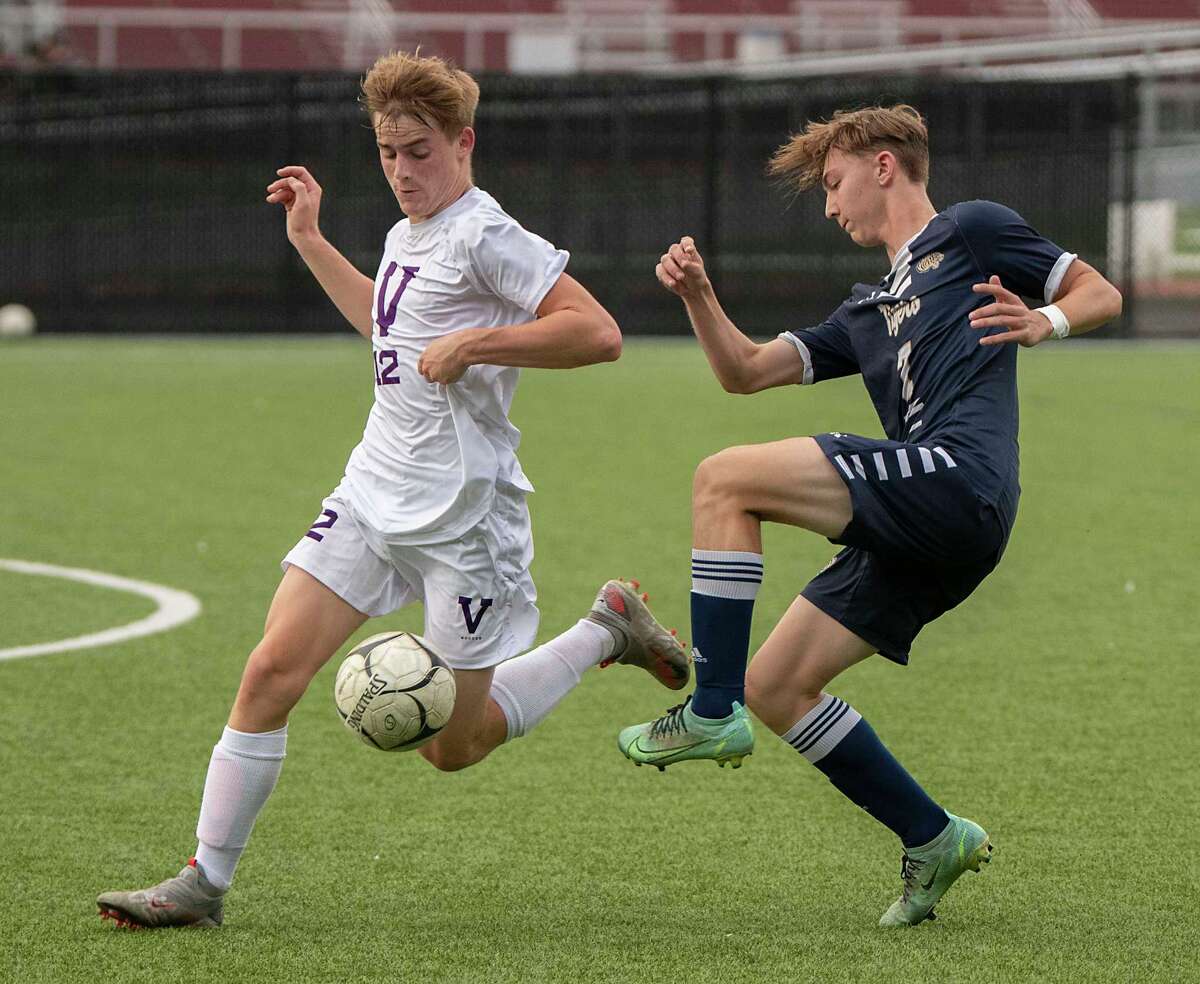 Voorheesville's Daniel Wittman, left, battles for the ball with Cohoes' Zack Halloran during the Colonial Council tournament boys' soccer game on Wednesday, Oct, 13, 2021 in Troy, N.Y.