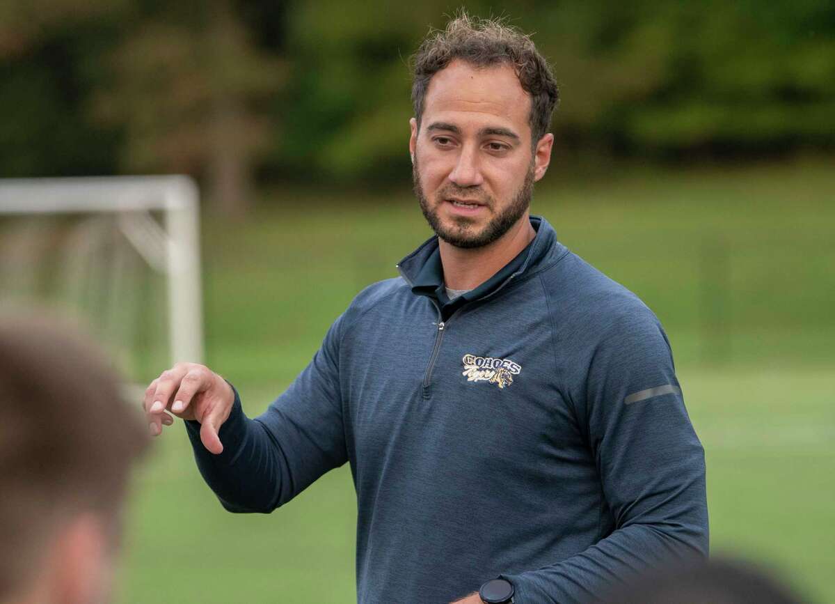 Cohoes head coach Nick Izzo talks to his team during the Colonial Council tournament boys' soccer game against Voorheesville on Wednesday, Oct, 13, 2021 in Troy, N.Y.