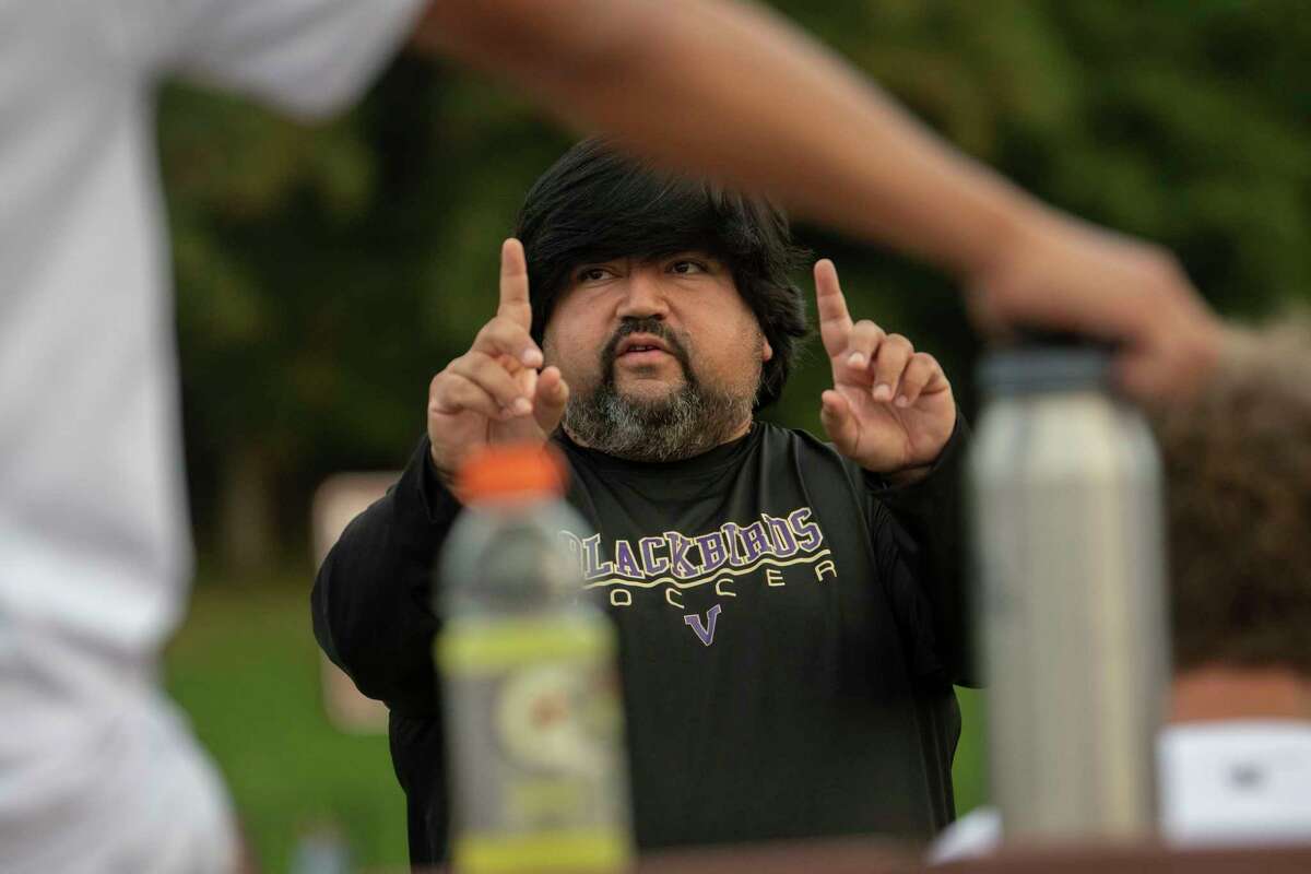 Voorheesville head coach Willie Sanchez talks to his team during the Colonial Council tournament boys' soccer game against Cohoes on Wednesday, Oct, 13, 2021 in Troy, N.Y.