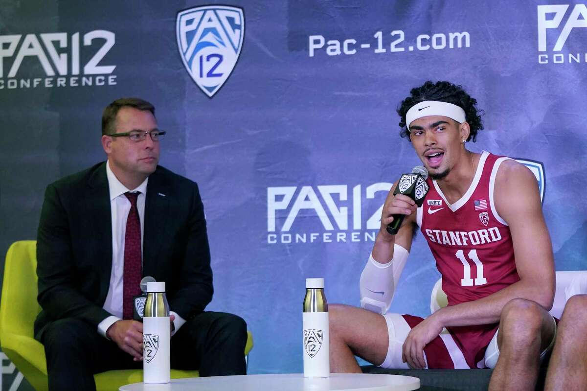Stanford's Jaiden Delaire, right, speaks next to head coach Jerod Haase during the Pac-12 Conference NCAA college basketball media day Wednesday, Oct. 13, 2021, in San Francisco. (AP Photo/Jeff Chiu)
