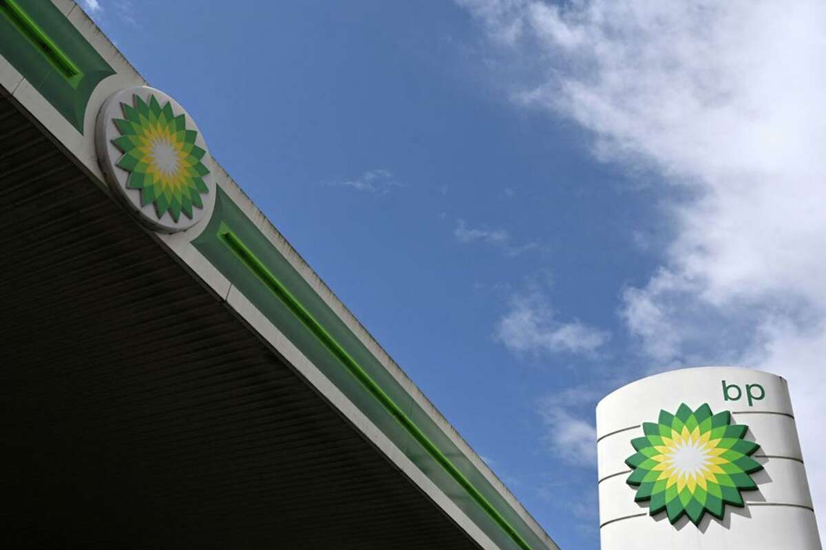 BP logos are pictured at a BP petrol and diesel filling station in north London on May 12, 2021. (Glyn Kirk/AFP via Getty Images/TNS)