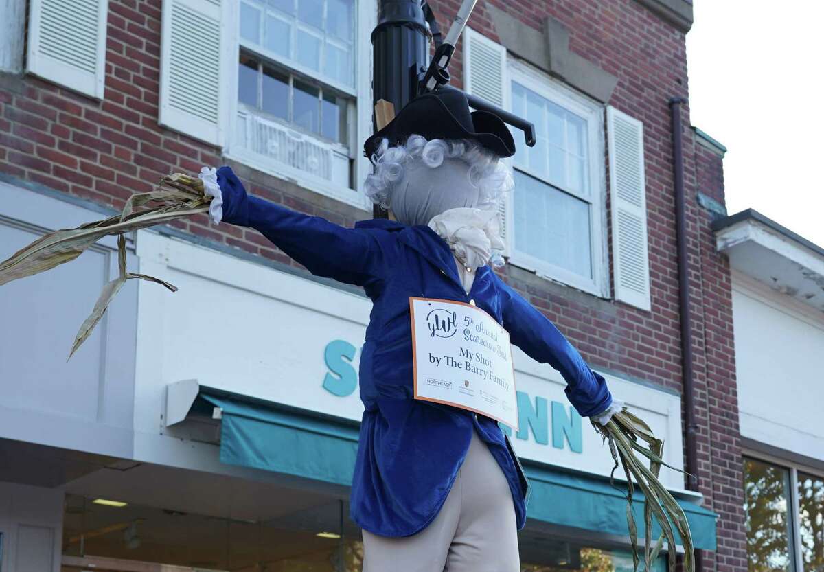 A homage to the play Hamilton is one of the scarecrows hanging from lampposts on Elm Street in New Canaan on Oct. 12, 2021.