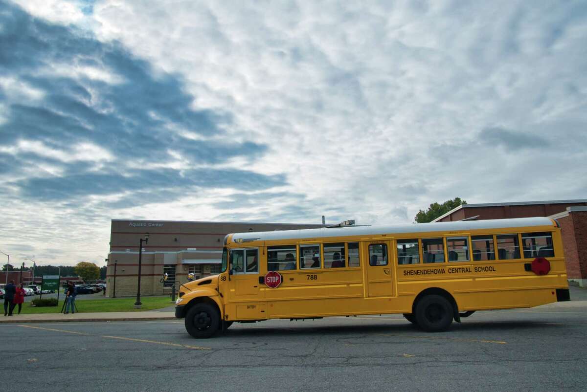A school bus is driven through the Shenendehowa School District campus by a member of the public trying out being a bus driver on Thursday, Oct. 14, 2021, in Clifton Park, N.Y.