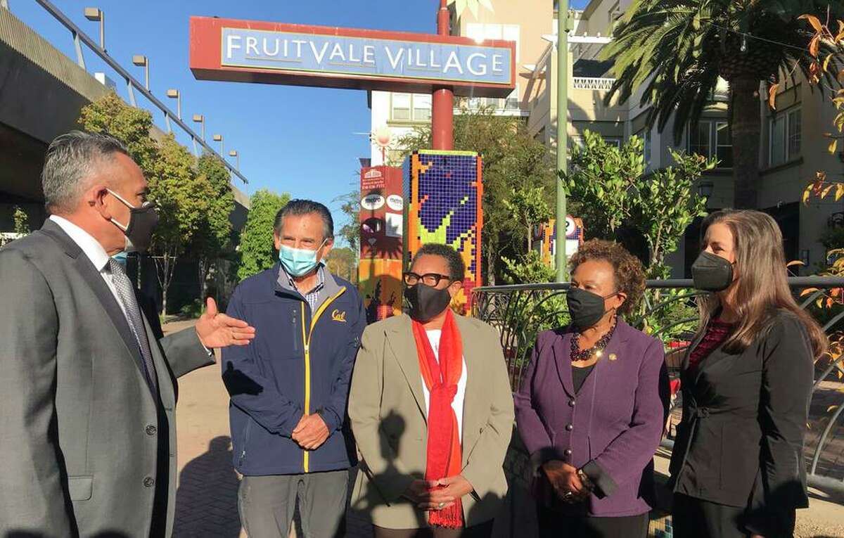 HUD Secretary Marcia Fudge (center) tours the Fruitvale Transit Village as Chris Iglesias (left), CEO of the Unity Council, talks about the project with City Council Member Noel Gallo, Rep. Barbara Lee and Mayor Libby Schaaf.