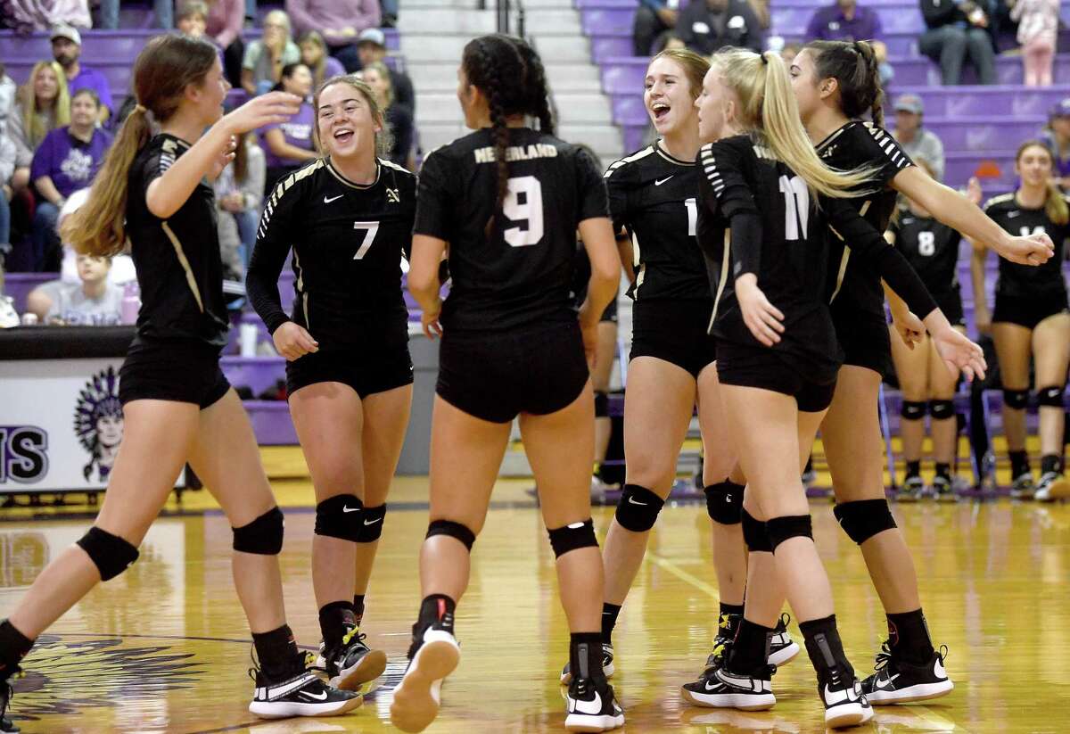 Nederland celebrates a score against Port Neches-Groves during their Mid-County Madness volleyball match-up Tuesday at PNG. Photo made Tuesday, September 28, 2021 Kim Brent/The Enterprise