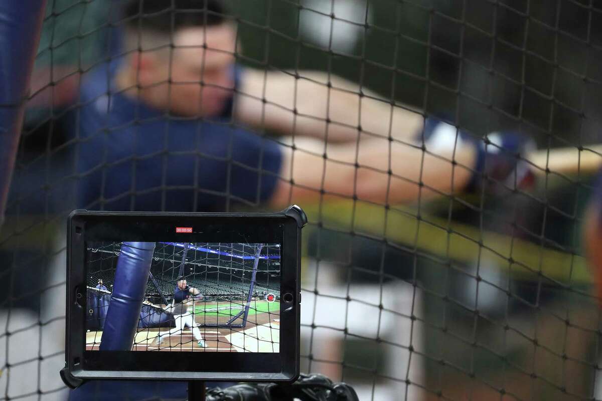 Astros third baseman Alex Bregman is shown on a video screen as he takes batting practice during a workout the day before Game 1 of the American League Championship Series against the Boston Red Sox.