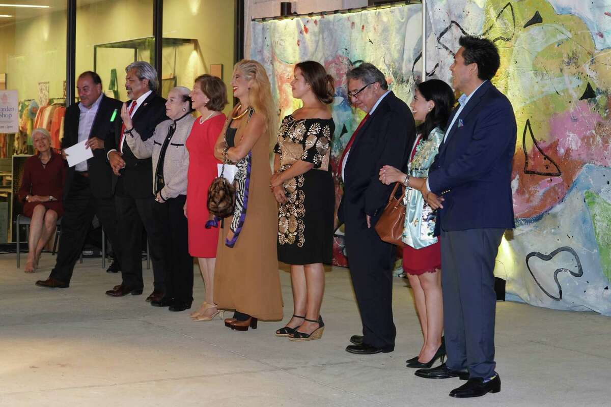 Left, Karla Cisneros, Houston Councilmember, and board members of ALMAAHH at an event in the Houston Botanic Garden celebrating fundraising achievements for the creation of a Latino cultural art complex in Houston, on October 12, 2021. The board members are, from left, Massey Villarreal, CEO and President of Precision Task Group, Inc.; David Medina, former Texas Supreme Court justice; Dorothy Caram, former educator and founder of the Institute of Hispanic Culture in Houston; Nelly Fraga, executive director of the Ambassadors International Ballet Folklorico; Sofia Adrogué, lawyer and Latino advocate; Nory Angel, regional president of the American Leadership Forum; David Contreras, former banker and Texas LULAC historian; Norma Torres Mendoza, management consultant; Tony Diaz, author and founder of Nuestra Palabra.