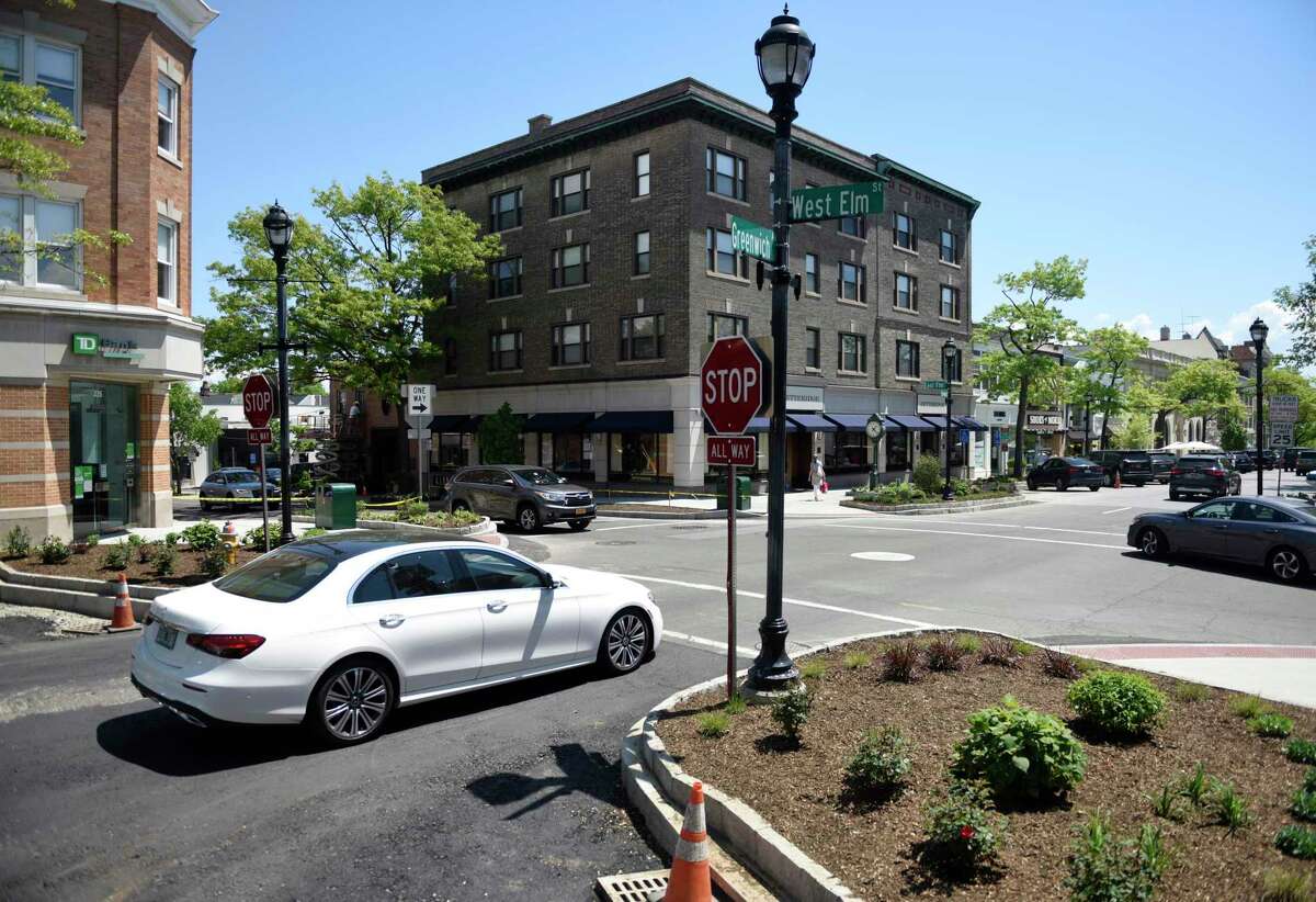 Traffic and pedestrians cross the newly renovated intersection of Greenwich Avenue and Elm Street in Greenwich, Conn. Monday, May 17, 2021.