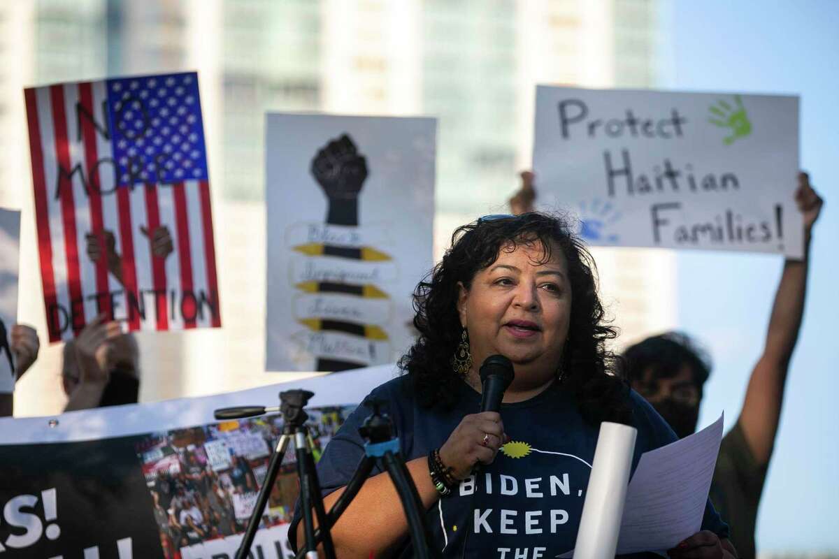 Debra Ponce of RAICES speaks during a rally held Thursday evening on the steps of the John H. Wood Jr. U.S. Courthouse downtown. About 30 people participated in the event held as part of a national day of protest.