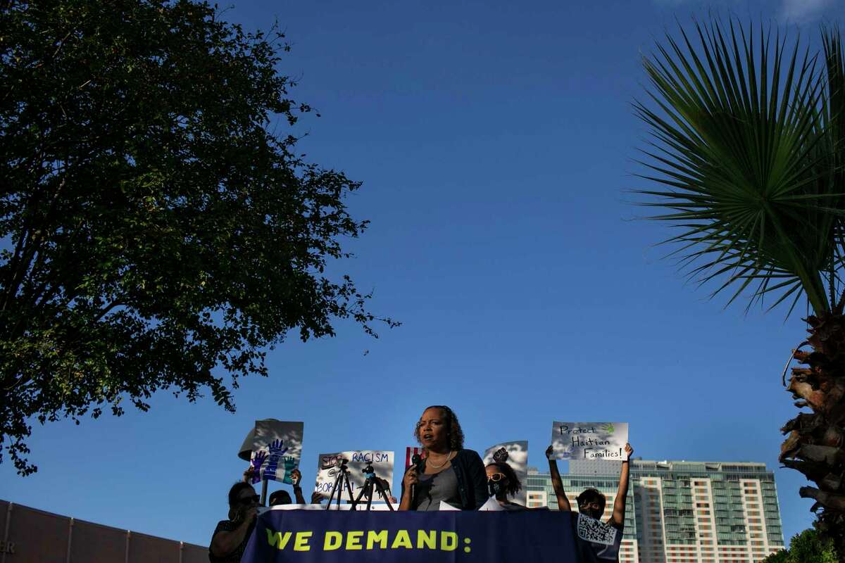 Nichole Morgan, an attorney with RAICES, speaks during the rally held to stand in solidarity with Black migrants and share the demands of Haitian asylum seekers.