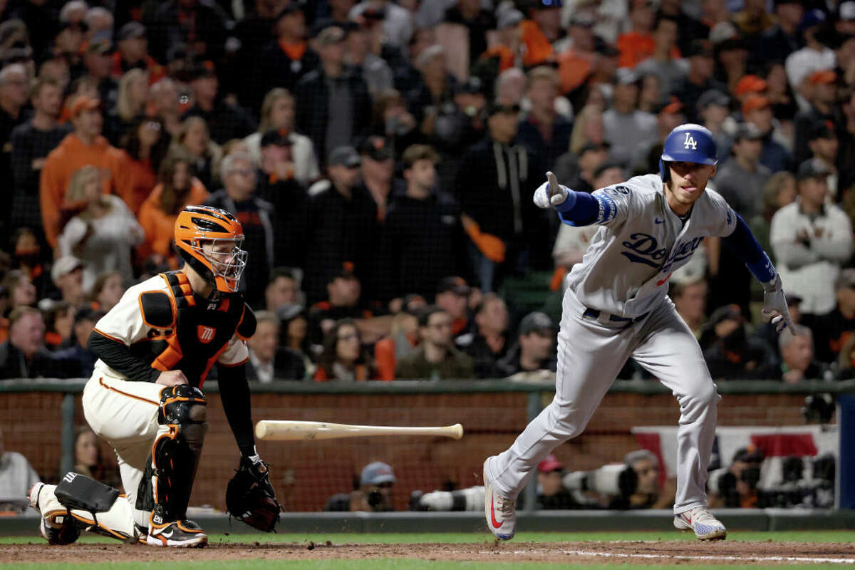 Cody Bellinger of the Los Angeles Dodgers celebrates his RBI single to score Justin Turner against the San Francisco Giants during the ninth inning in game 5 of the National League Division Series at Oracle Park on October 14, 2021.