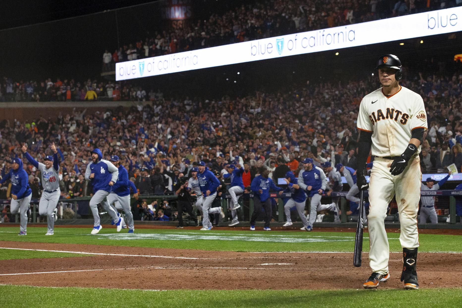 Wilmer Flores of the San Francisco Giants is congratulated by J.D. News  Photo - Getty Images