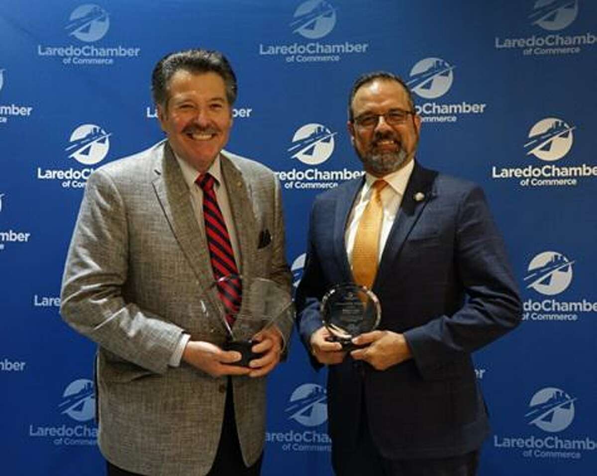 Laredo Mayor Pete Saenz and City Manager Robert Eads are pictured accepting awards from the Laredo Chamber of Commerce.