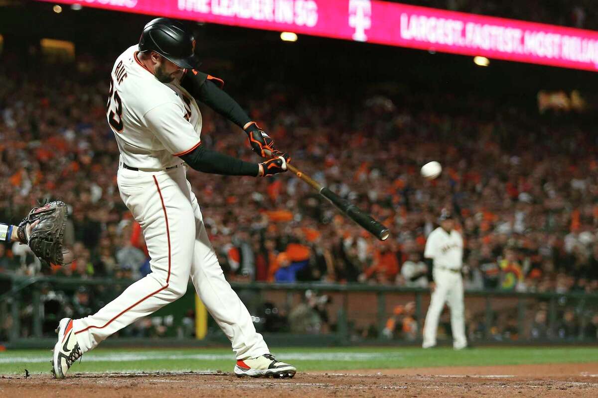 San Francisco Giants' Darin Ruf hits a home run against the Los Angeles Dodgers during the sixth inning of Game 5 of a baseball National League Division Series Thursday, Oct. 14, 2021, in San Francisco. (AP Photo/Jed Jacobsohn)