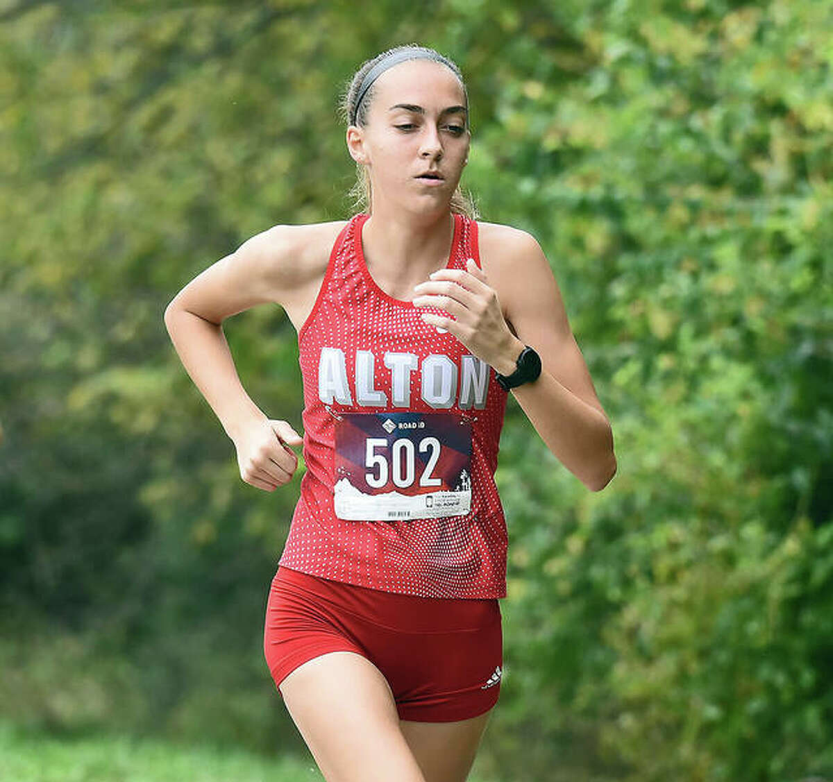 Sophia Paschal of Alton runs the course at Thursday’s Southwestern Conference girls cross country meet in Belleville. Paschal was the Redbirds’ lone runner at the meet and finished 18th in a time of 20:53.70.