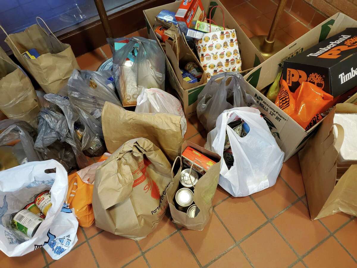 Items from Shelton High School varsity basketball team players, and coaches previoua basketball shooting clinic in a recent year, are shown. The players, and the coaches, taught younger children in attendance at the clinic, basketball skills, and collected food for the school’s Audrey Dreyer Food Bank. The Shelton Public School District’s annual Fill-the-Truck food drive event for the school’s Audrey Dreyer Food Bank, will take place, Oct. 29, at Shelton High School’s Finn Stadium, where the Shelton High School Gaels varsity football team will play the Newtown High School Nighthawks varsity football team at 7 p.m.