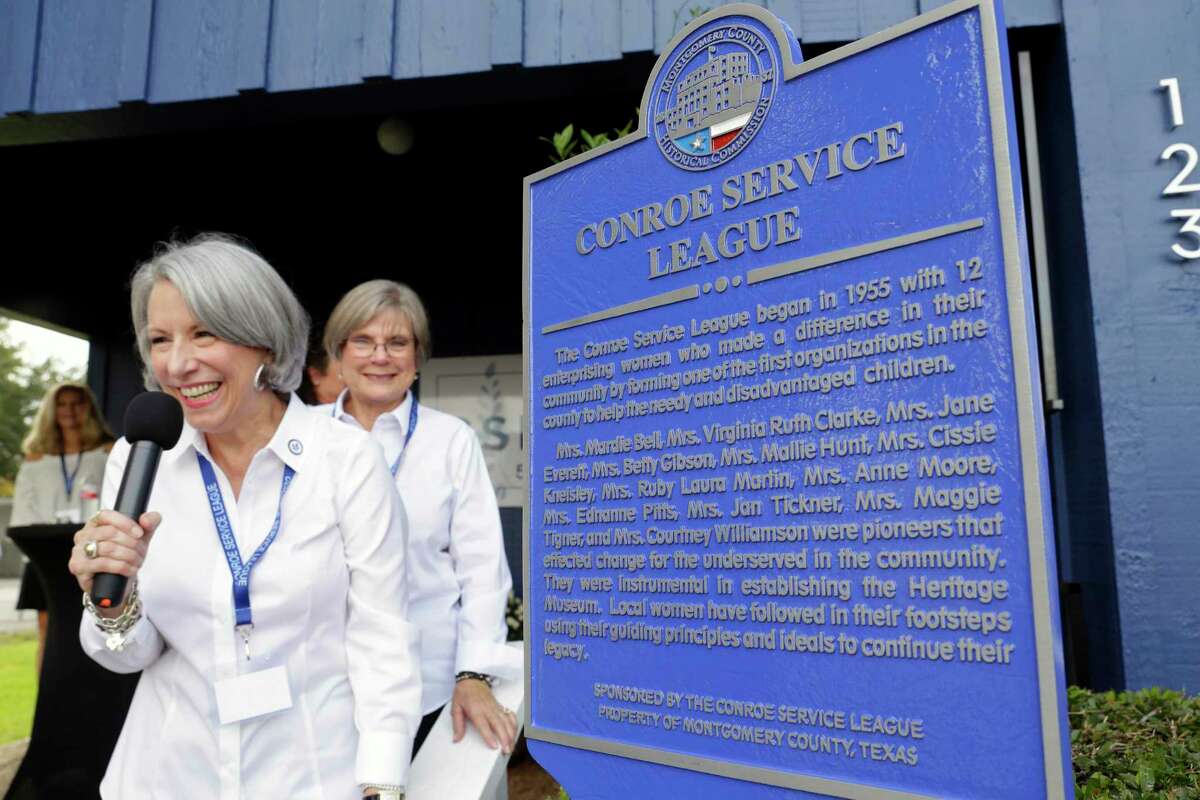 Nila Ciesiel, left, community liasion for the Conroe Service League, comments after the unveiling of a historical marker by the Montgomery County Historical Commission honoring the League at the Bargain Box Resale Shop Thursday, Oct. 14, 2021 in Conroe.