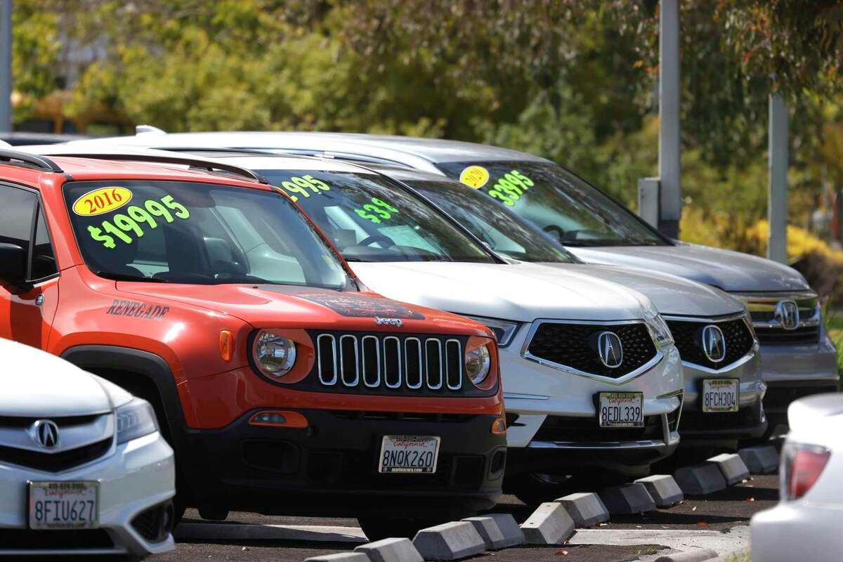 Used cars are displayed on the sales lot of a dealer in Corte Madera, Calif.