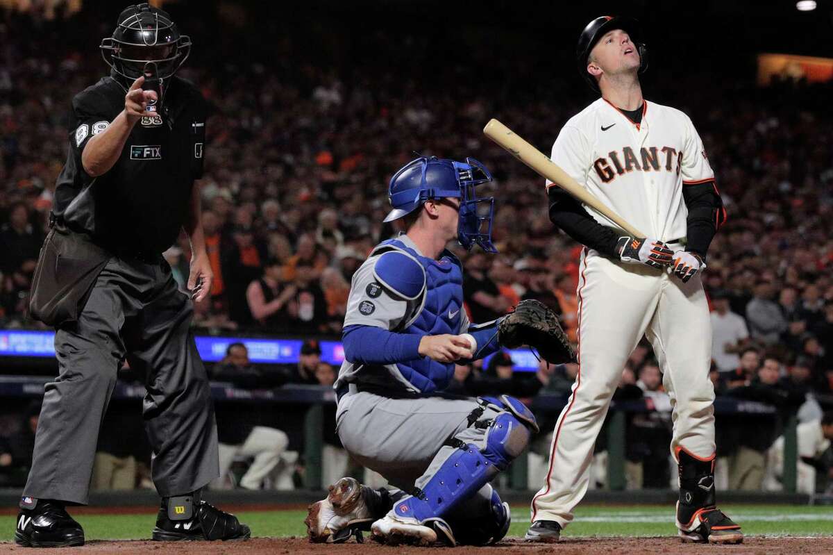 San Francisco Giants Buster Posey (28) reacts to a called strike during the eighth inning as the San Francisco Giants played the Los Angeles Dodgers in Game 5 of the National League Division Series at Oracle Park in San Francisco, Calif., on Thursday, October 14, 2021.