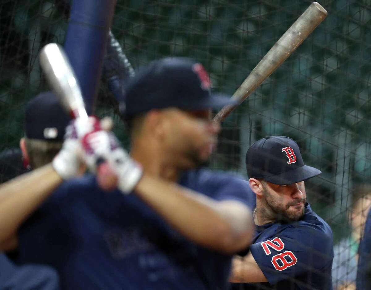 Boston Red Sox designated hitter J.D. Martinez (28) takes batting practice during a workout the day before Game 1 of the American League Championship Series against the Houston Astros Thursday, Oct. 14, 2021 in Houston.