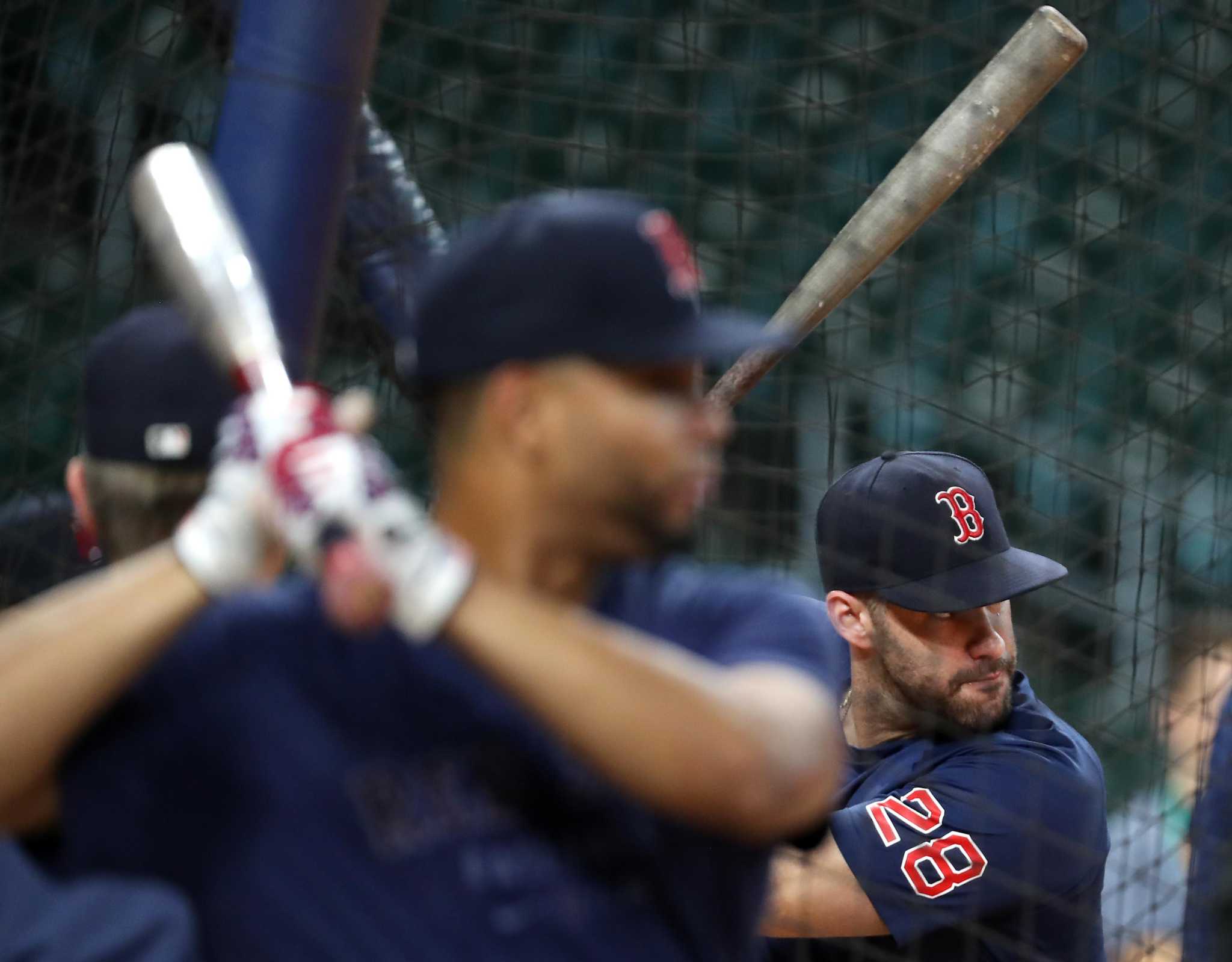 Boston Red Sox's J.D. Martinez, right, is greeted by Xander