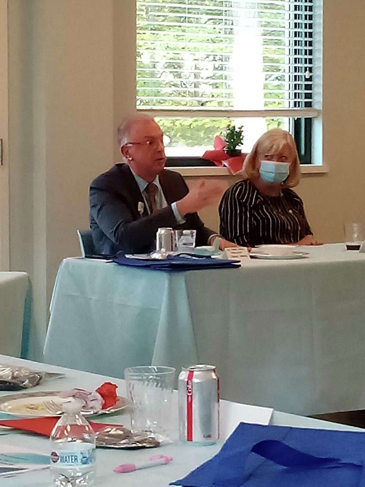 Community Health & Wellness Center of Greater Torrington's CEO, Joanne Borduas, held a round table discussion Friday on the challenges of providing health care and mental health services to rural communities. Sharon Hospital president Mark Hirko speaks during the discussion. He is seated with