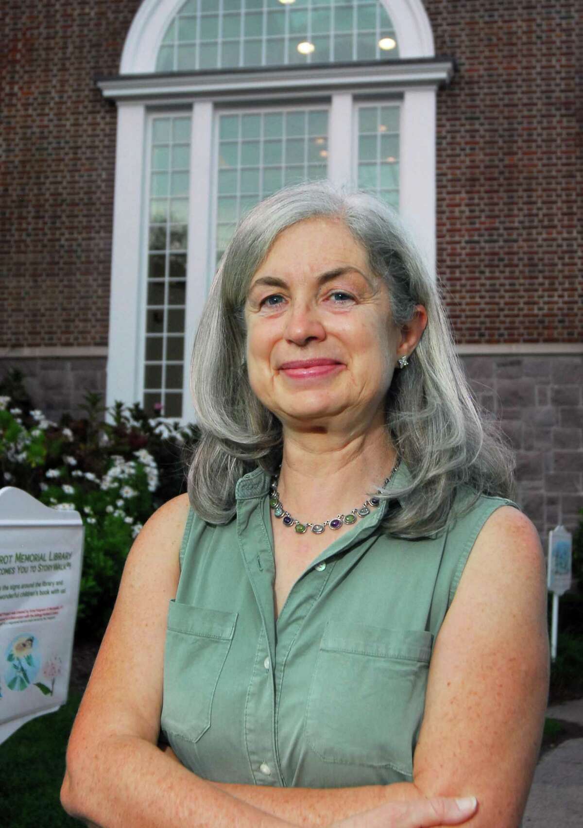 Janet Stone McGuigan, who is running for the Board of Selectmen, stands outside Perrot Library in Old Greenwich.