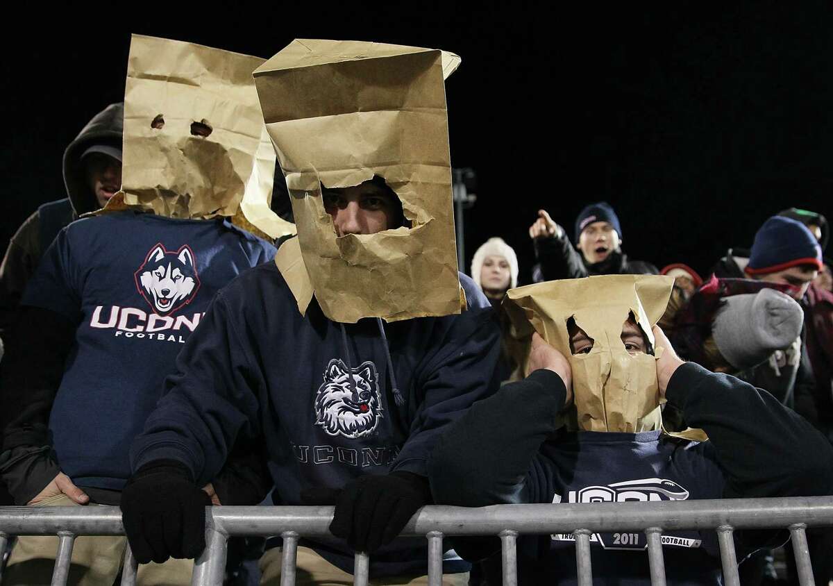 UConn fans wear bags on their heads during a 2013 game against Louisville in East Hartford.