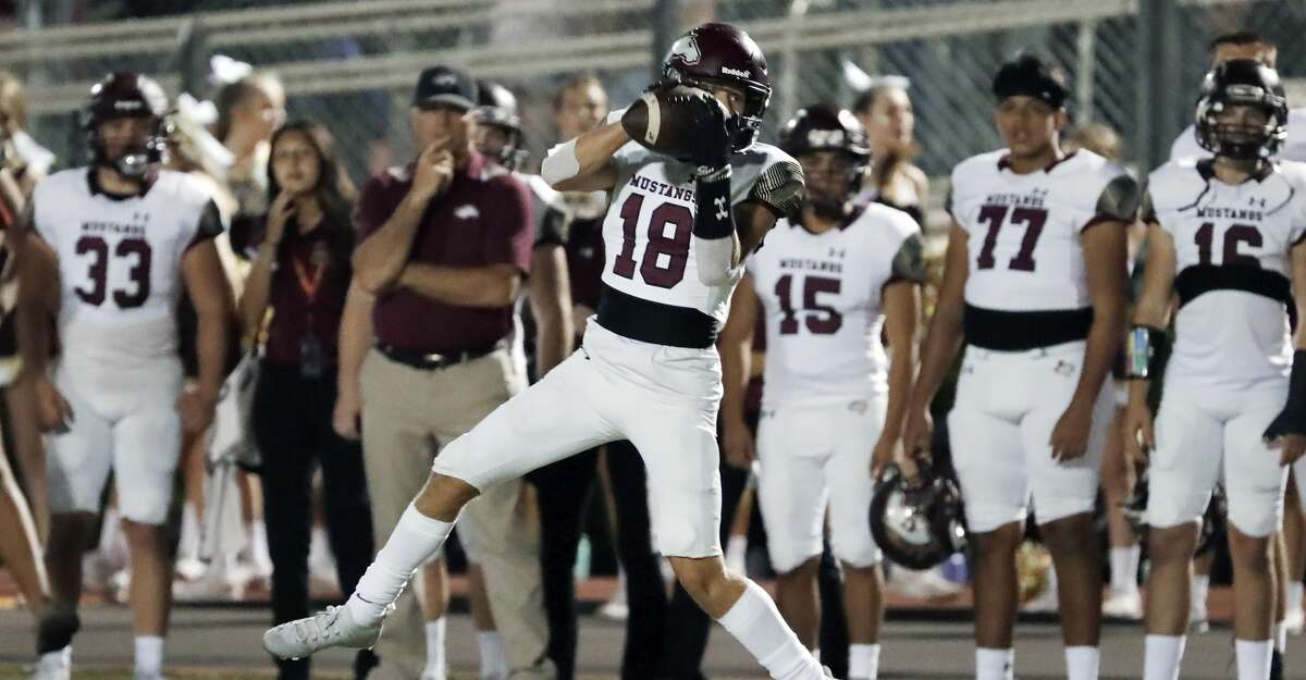 Magnolia West wide receiver Colton Adcox makes the reception during the first half of their District 8 5A, D1 high school football game against Magnolia at Bulldog Stadium Friday, Oct. 15, 2021 in Magnolia, TX.