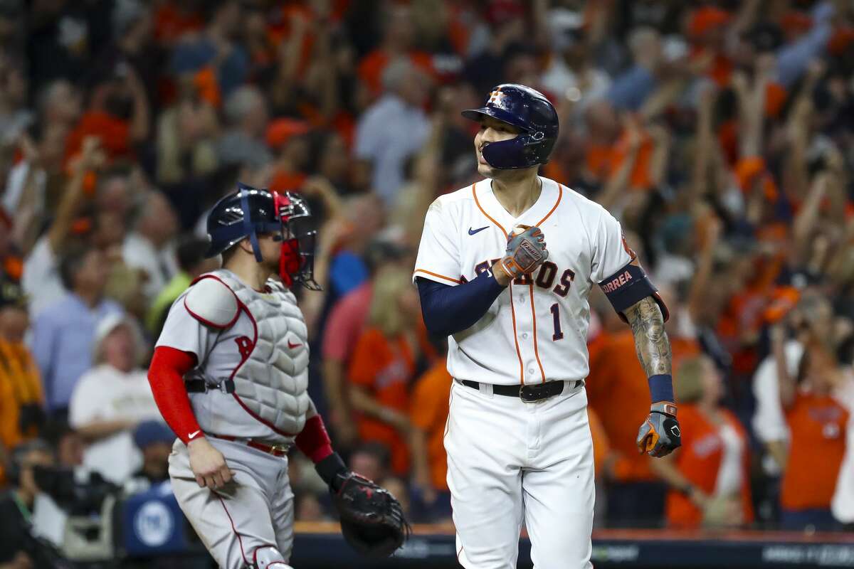 Houston Astros shortstop Carlos Correa (1) pounds his chest after hitting a solo home run to give the Astros a 4-3 lead during the seventh inning in Game 1 of the American League Championship Series on Friday, Oct. 15, 2021, at Minute Maid Park in Houston.