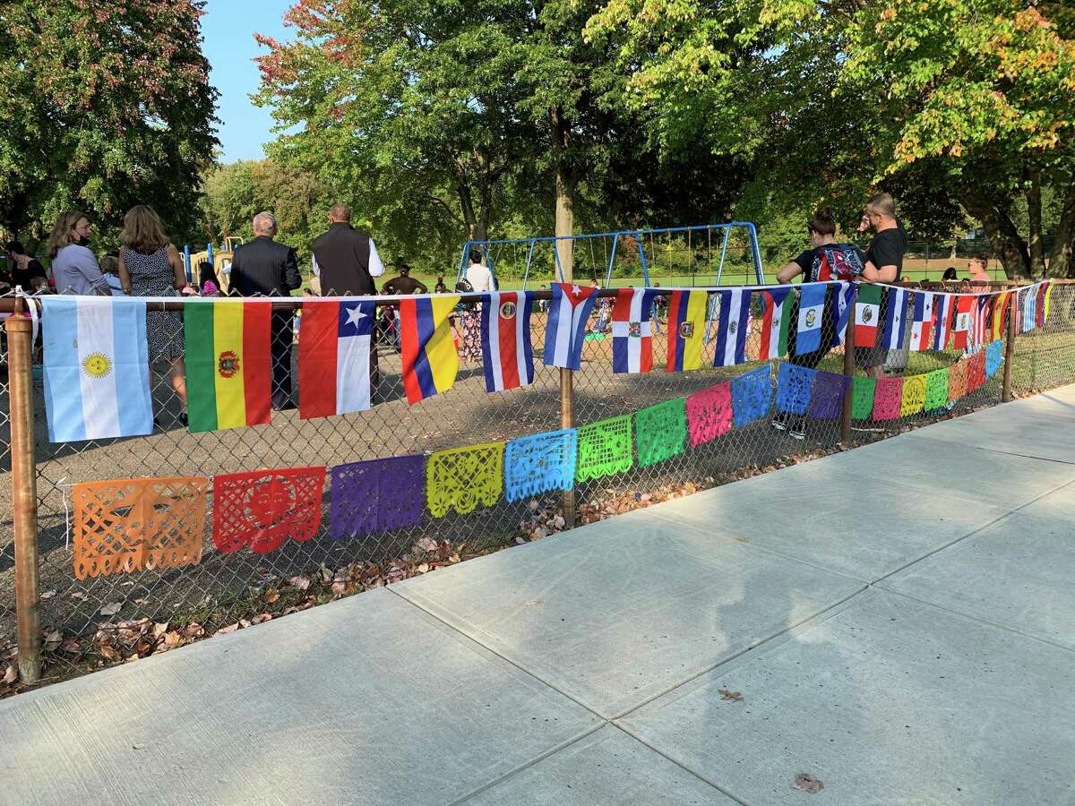 Flags representing the countries of Fox Run Elementary's Latinx students were hung on the playground fence.
