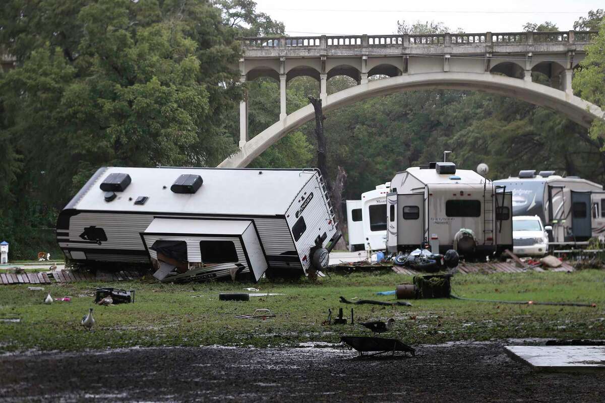 People clean up at the River Ranch RV Resort in New Braunfels on Thursday, Oct. 14, 2021. Heavy rains from Tropical Storm Pamela flooded Guadalupe River overnight. One RV was swept away by the high waters and several others were damaged. New Braunfels closed both the Guadalupe and Comal River on Thursday because of unsafe conditions.