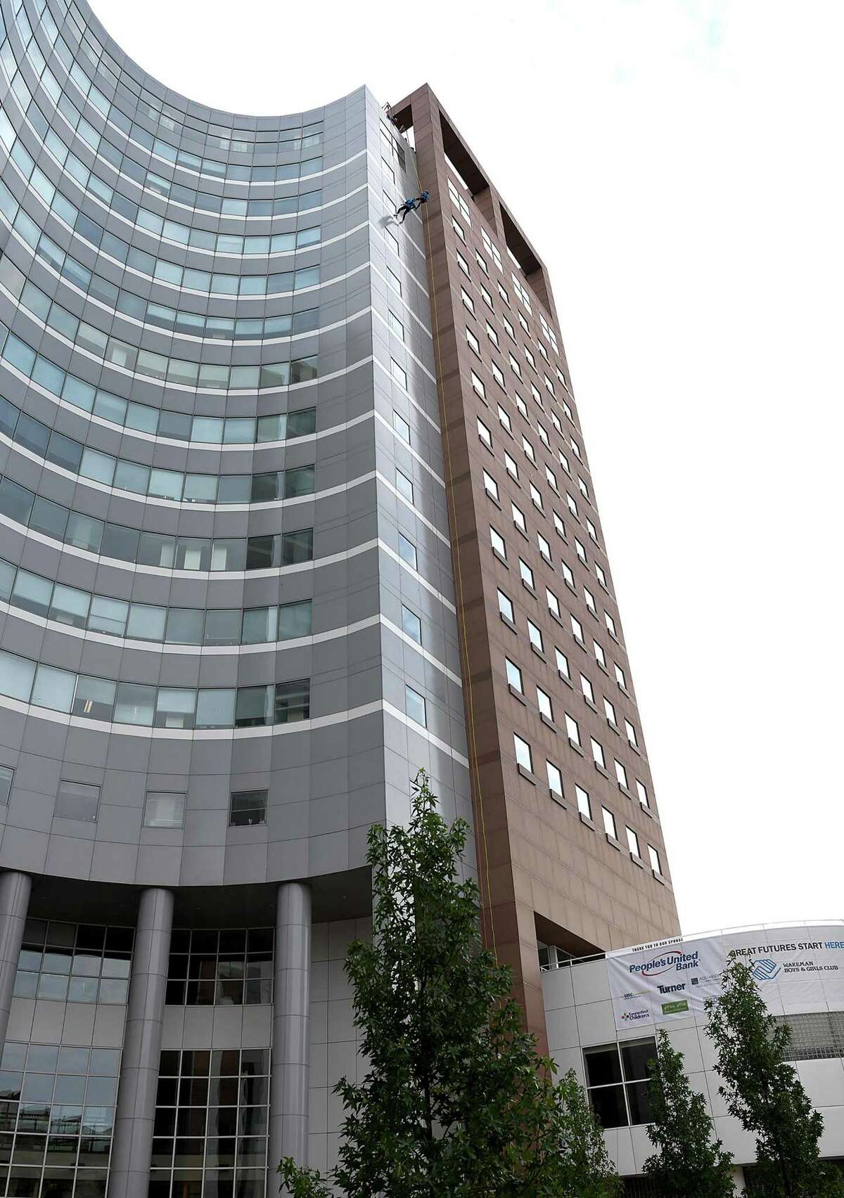 In a fundraising effort for Wakeman’s Boys and Girls Club in Southport, people rappelled down the People’s United Bank building in Bridgeport Saturday, Oct. 16, 2021. The event was held in conjunction with Over the Edge.