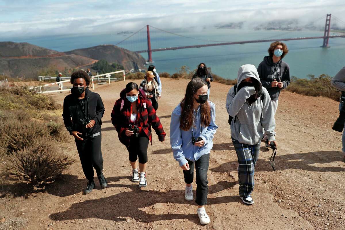 Independence High School students Ri’Keyah George (left), Arianna Niu, Mia Heather, Leah Zhu and Misha Orlow-Ornstein walk up to Hawk Hill during a class bird-watching trip in Sausalito.