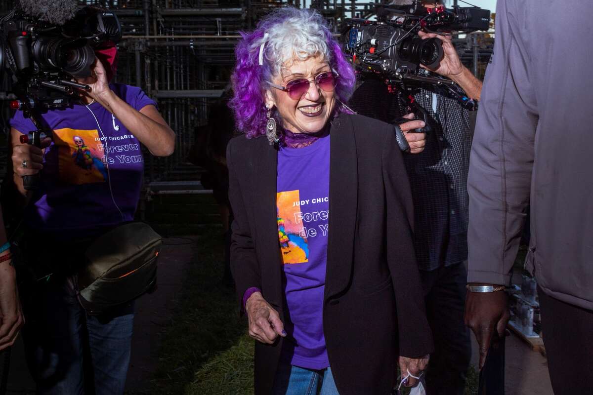 Judy Chicago welcomes friends and supporters immediately following her Forever de Young installation on October 16, 2021. (Kevin Kelleher / Special to SFGATE)