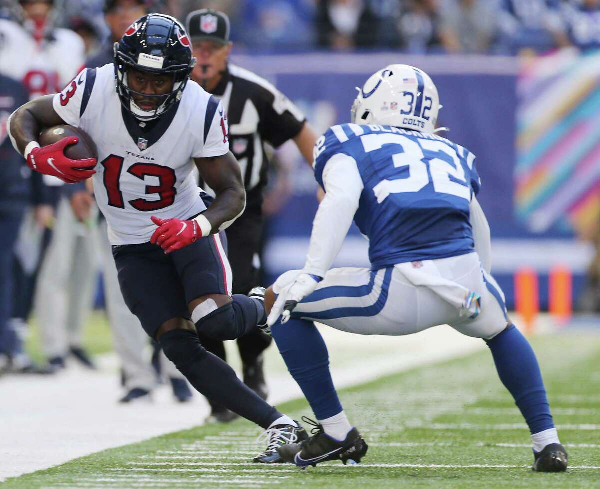 Houston Texans wide receiver Brandin Cooks (13) takes to stay inbounds as Indianapolis Colts free safety Julian Blackmon (32) tries to stop him at Lucas Oil Stadium in Indianapolis on Sunday, Oct. 17, 2021. Indianapolis Colts won the game 31-3.