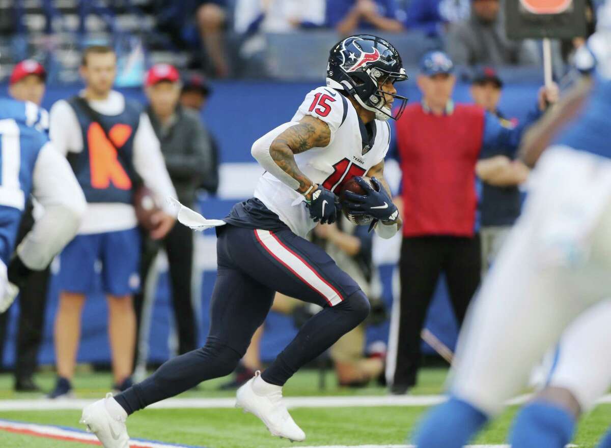 Houston Texans wide receiver Chris Moore (15) runs for extra yards in the first half of game action against the Indianapolis Colts at Lucas Oil Stadium in Indianapolis on Sunday, Oct. 17, 2021. Indianapolis Colts won the game 31-3.